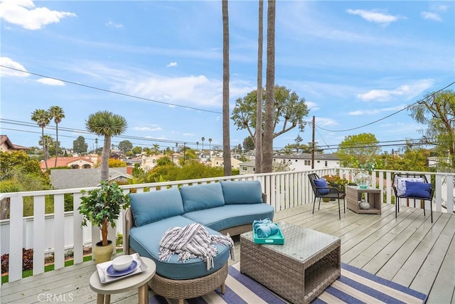 wooden deck with an outdoor hangout area