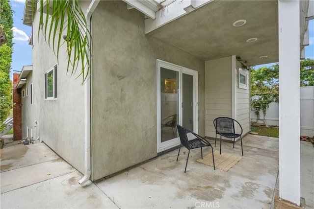 view of patio featuring fence