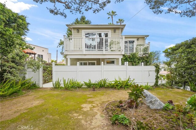 rear view of house with fence