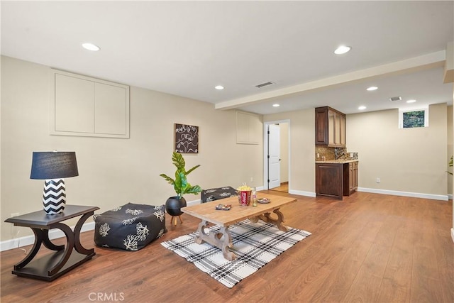 interior space featuring visible vents, recessed lighting, baseboards, and light wood-style floors