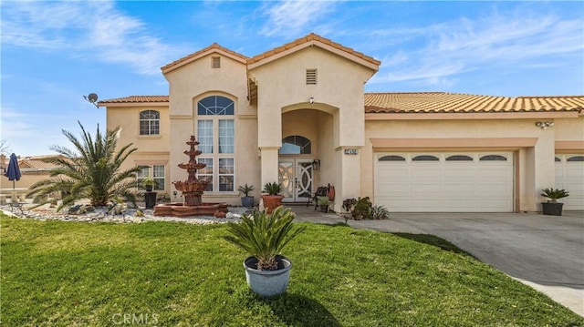 mediterranean / spanish home featuring an attached garage, driveway, french doors, stucco siding, and a front yard