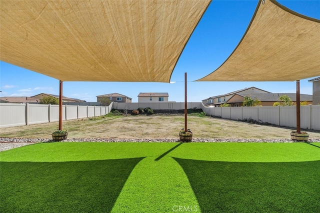 view of yard featuring a fenced backyard