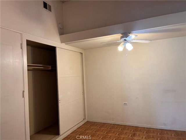 unfurnished bedroom featuring a ceiling fan, a closet, and visible vents