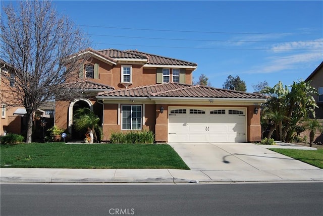 view of front of property with stucco siding, concrete driveway, an attached garage, a tiled roof, and a front lawn