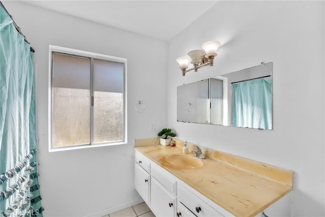 full bathroom featuring baseboards, vanity, and tile patterned floors