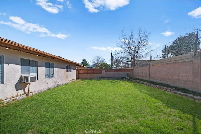 view of yard with cooling unit and a fenced backyard