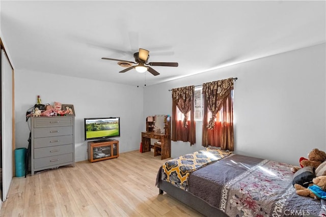 bedroom with ceiling fan and wood finished floors