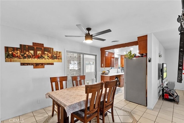 dining room featuring light tile patterned floors, ceiling fan, and visible vents