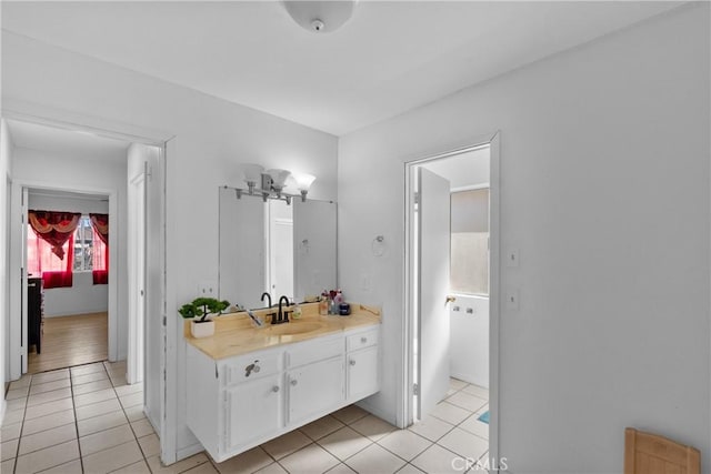 bathroom with tile patterned flooring and vanity