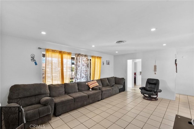 living area featuring recessed lighting, visible vents, and light tile patterned floors