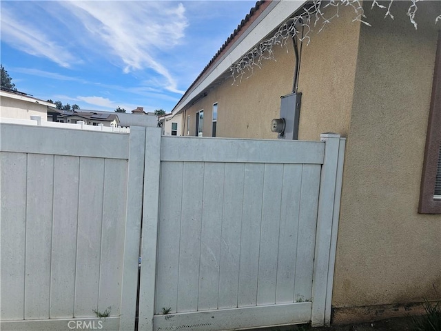 view of gate featuring fence