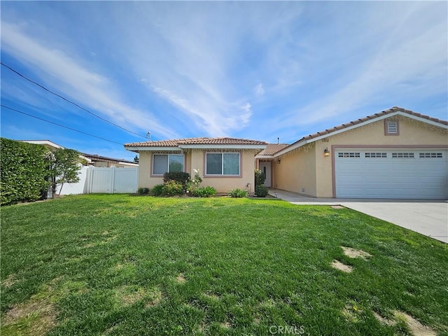 single story home with a garage, fence, a front lawn, and stucco siding