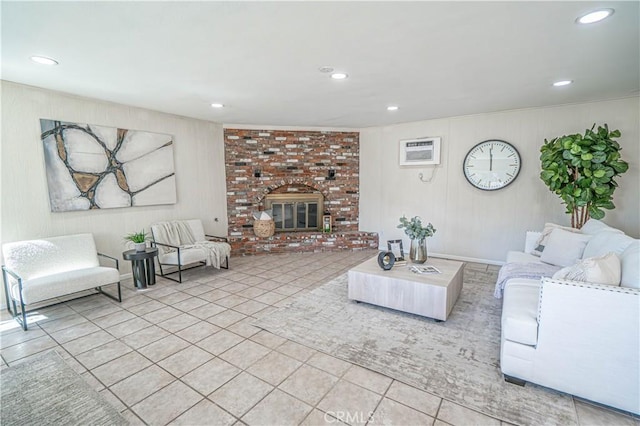 living room featuring a brick fireplace, tile patterned flooring, and recessed lighting