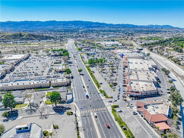 birds eye view of property featuring a mountain view