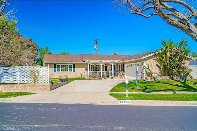 single story home with stucco siding, an attached garage, fence, a pergola, and driveway