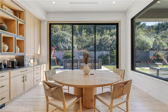 4050 Contera Rd, Encino, CA 91436 - dining space featuring recessed lighting, healthy amount of natural light, and light wood-style floors