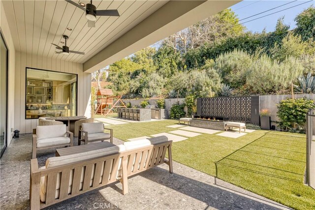 4050 Contera Rd, Encino, CA 91436 - view of patio / terrace featuring a playground, a ceiling fan, and outdoor lounge area