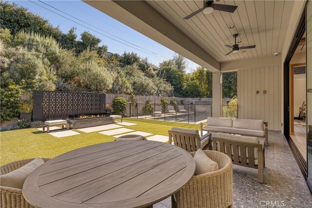 4050 Contera Rd, Encino, CA 91436 - view of patio / terrace featuring a ceiling fan, outdoor dining area, and an outdoor living space