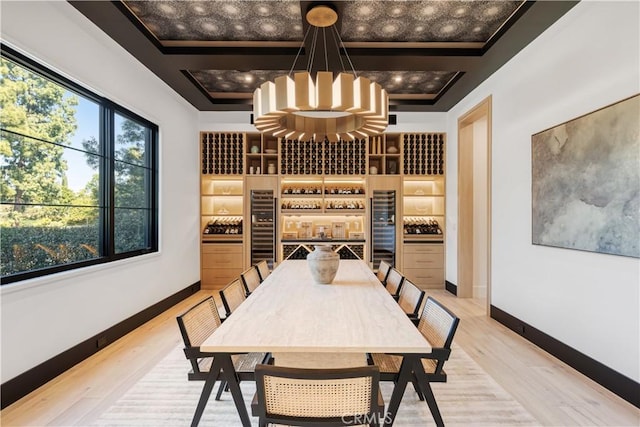 4050 Contera Rd, Encino, CA 91436 - wine cellar with wine cooler, light wood finished floors, and a chandelier