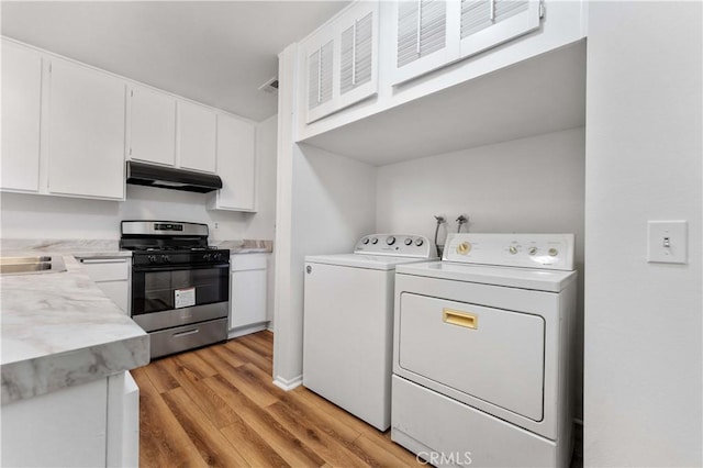 4738 Knoll Wood Ct, Oceanside, CA 92056 - washroom with washing machine and clothes dryer and light wood-style floors