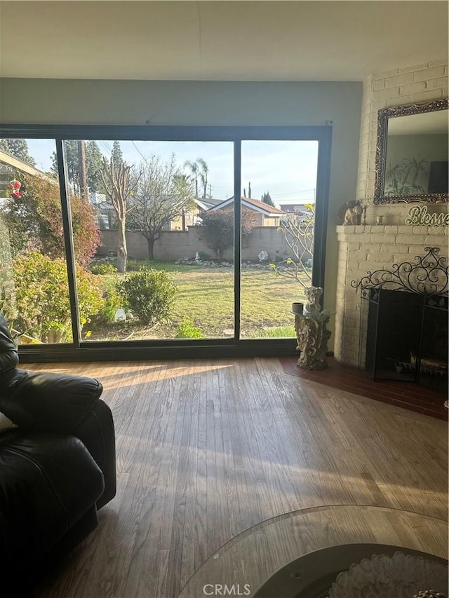 sunroom / solarium with a fireplace