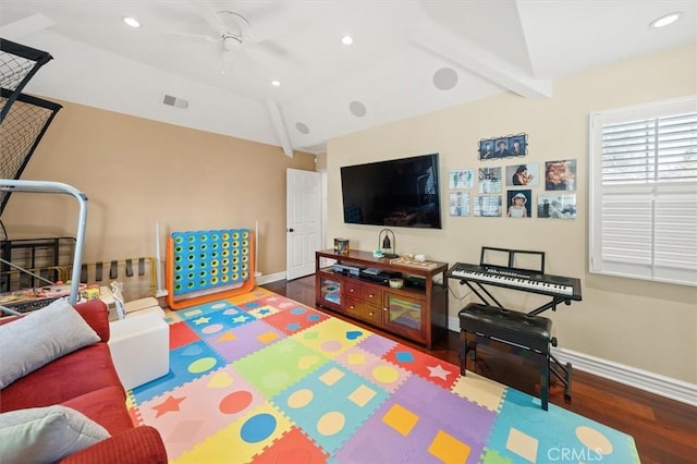 playroom with vaulted ceiling with beams, recessed lighting, wood finished floors, visible vents, and baseboards