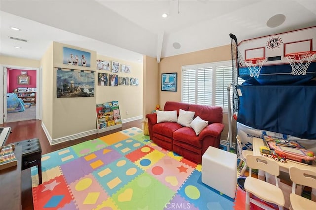 recreation room with recessed lighting, visible vents, vaulted ceiling, wood finished floors, and baseboards