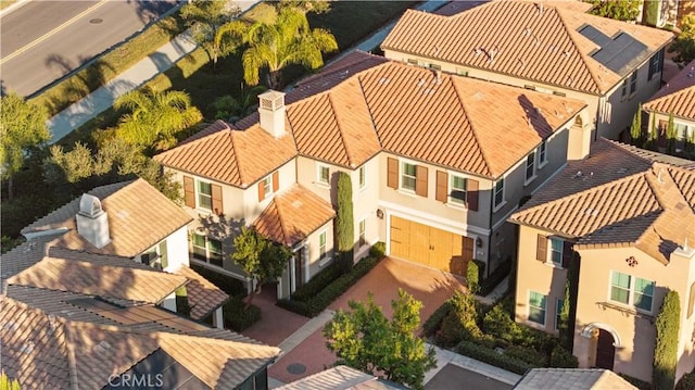 birds eye view of property with a residential view