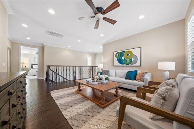 living area with hardwood / wood-style flooring, visible vents, a wealth of natural light, and recessed lighting