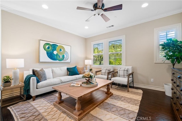 living room featuring hardwood / wood-style flooring, recessed lighting, visible vents, baseboards, and crown molding