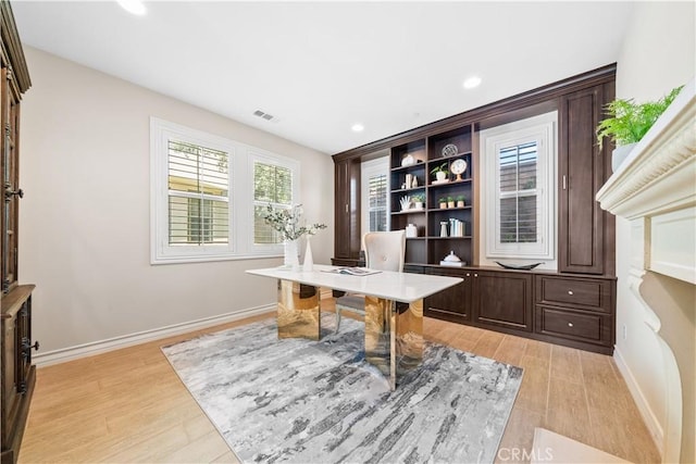 office area with baseboards, recessed lighting, visible vents, and light wood-style floors