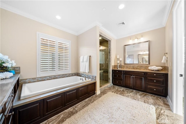 full bath featuring a garden tub, visible vents, ornamental molding, and vanity