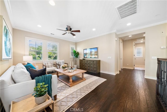 living area featuring ornamental molding, visible vents, dark wood finished floors, and baseboards