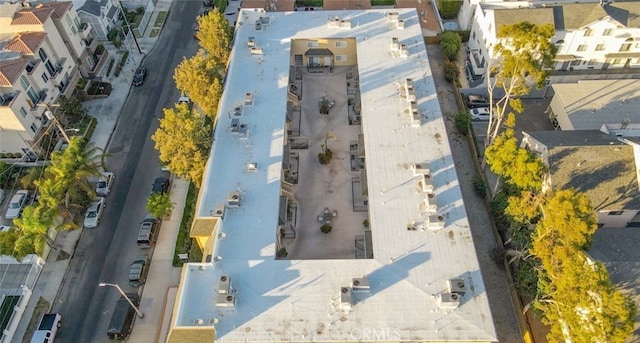 birds eye view of property with a residential view