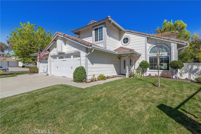 traditional-style home featuring a garage, driveway, a front yard, and a tiled roof