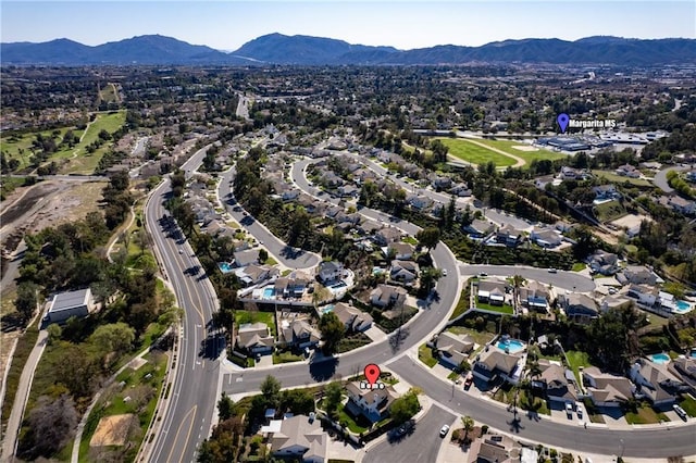 drone / aerial view with a residential view and a mountain view