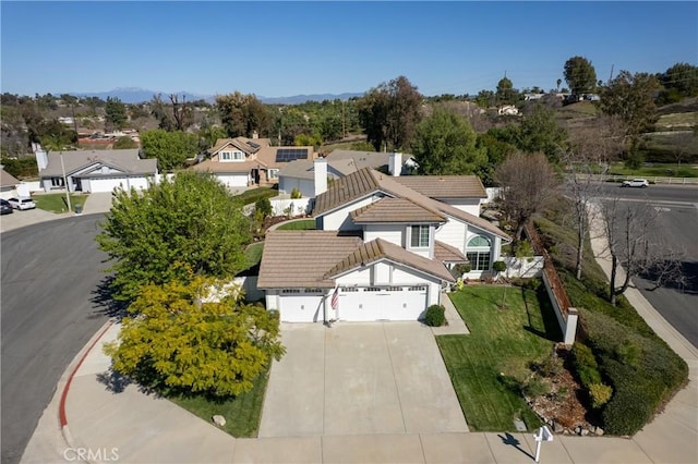 drone / aerial view with a residential view and a mountain view