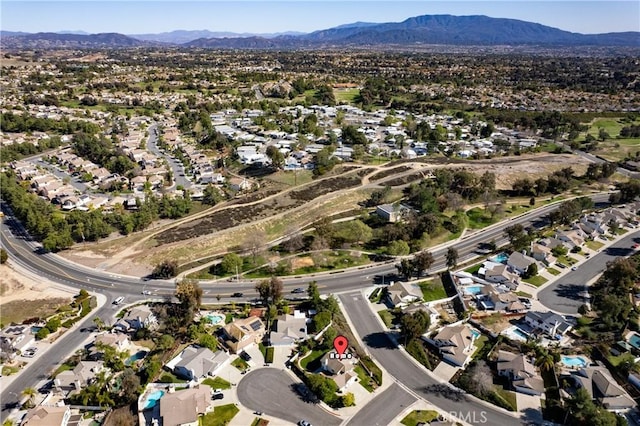 birds eye view of property with a residential view and a mountain view