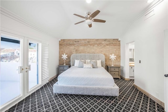 bedroom featuring lofted ceiling, french doors, crown molding, and baseboards