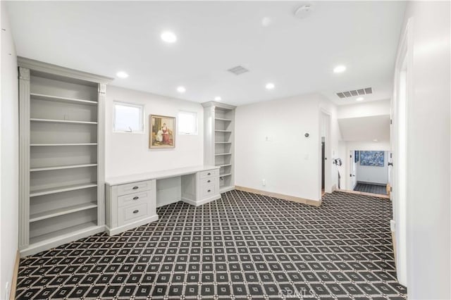 unfurnished office with carpet floors, recessed lighting, visible vents, built in study area, and baseboards