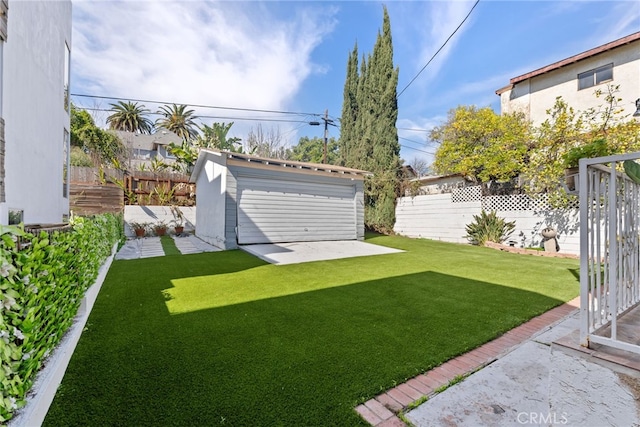 view of yard featuring a shed, an outdoor structure, and a fenced backyard