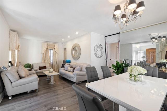 interior space featuring a chandelier, light wood-style flooring, and recessed lighting