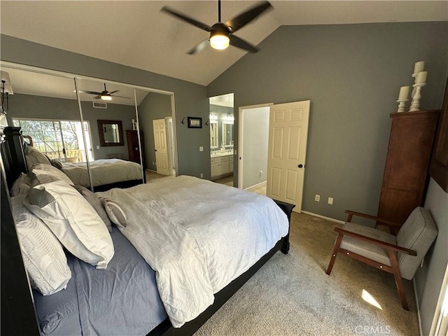 bedroom featuring light carpet, visible vents, baseboards, vaulted ceiling, and a closet