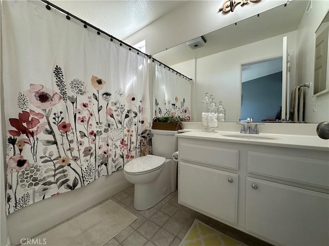 full bath featuring shower / bath combination with curtain, vanity, toilet, and tile patterned floors