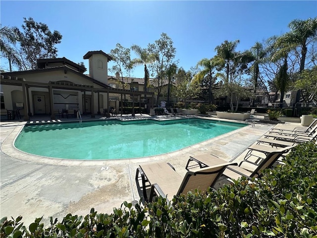 pool featuring a patio area