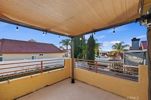 view of patio featuring a balcony