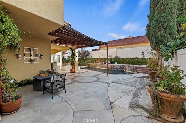 view of patio / terrace featuring a fenced backyard and a fenced in pool