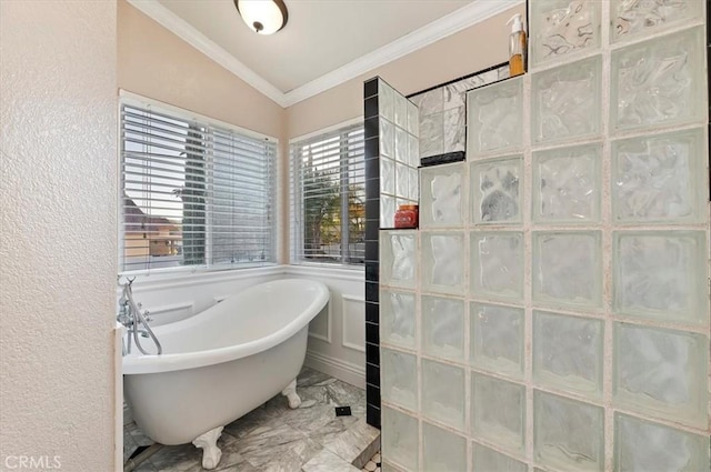 full bathroom featuring a textured wall, lofted ceiling, a soaking tub, ornamental molding, and marble finish floor