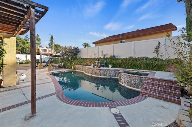 view of swimming pool featuring an in ground hot tub, a patio area, a fenced backyard, and a fenced in pool