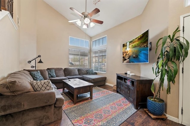 living room with a ceiling fan, baseboards, high vaulted ceiling, and wood finished floors